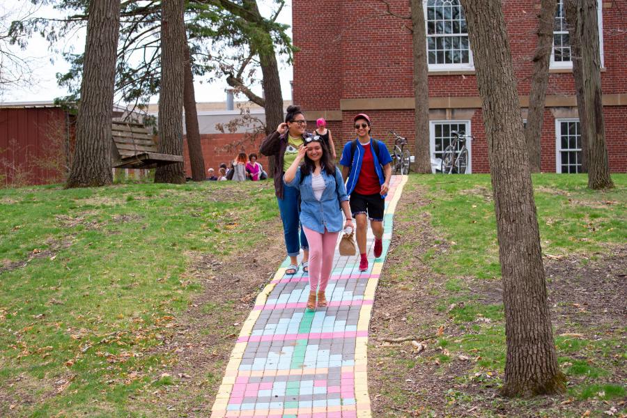 Students walk along the “Rainbow Path near the Wright Museum of Art.