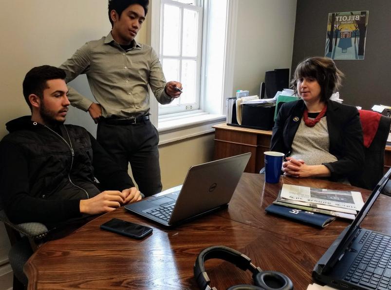 Ellie Anderbyrne'05, Caleb Nghe'20 and Gjergj Ndoci'20 discuss an analysis in the IRA...